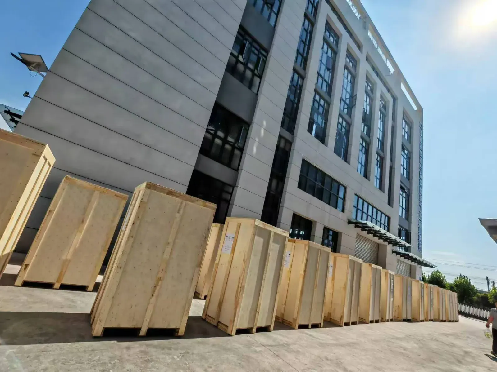 Row of packed EV charging equipment ready for batch dispatch