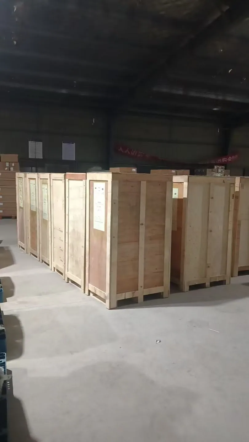 Timber-packed EV charging equipment staged inside a dispatch warehouse