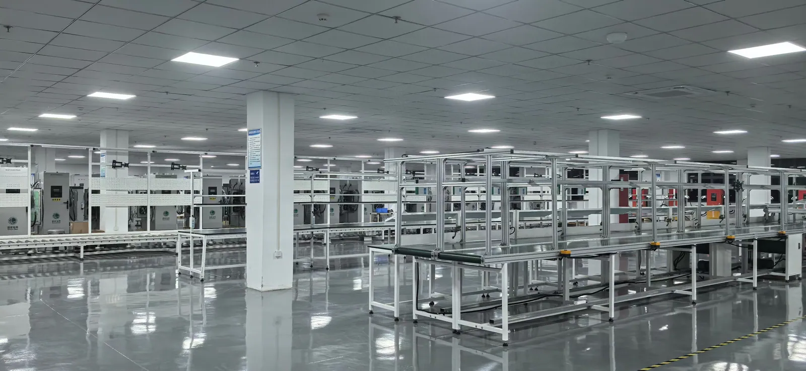 EV charger production workstations arranged inside a clean assembly workshop